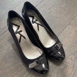 Anne Klein Sport black wedge shoe. 8.5”. Patent leather toe area w buckle.